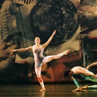 Merce Cunningham Dance Company performers with a backdrop by Robert Rauschenberg.